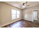 Cozy bedroom featuring hardwood floors, natural light, and ceiling fan at 1029 Katherwood Sw Dr, Atlanta, GA 30310