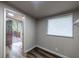 Bright bedroom featuring a door to deck and hardwood floors at 1029 Katherwood Sw Dr, Atlanta, GA 30310