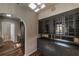 Butler pantry with stainless refrigerator and storage with glass doors for display at 1029 Katherwood Sw Dr, Atlanta, GA 30310