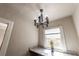 Antique-style chandelier fixture with granite countertop and view of the outside through the window at 1029 Katherwood Sw Dr, Atlanta, GA 30310