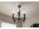 Chandelier hanging from a white ceiling, illuminating the room with candle-style lights at 1029 Katherwood Sw Dr, Atlanta, GA 30310