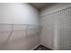 Walk-in closet with shelving and brick accent wall at 1029 Katherwood Sw Dr, Atlanta, GA 30310