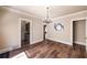 Spacious dining room with hardwood floors, elegant chandelier, and neutral paint at 1029 Katherwood Sw Dr, Atlanta, GA 30310