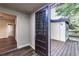 Inviting entryway with wood-look floors, decorative glass door and access to an outdoor wooden deck and a view of the backyard at 1029 Katherwood Sw Dr, Atlanta, GA 30310