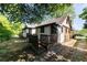 Side yard view of the exterior with a small deck and mixed brick and vinyl siding at 1029 Katherwood Sw Dr, Atlanta, GA 30310