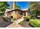 This brick home features a chimney, an exterior air conditioning unit, and trimmed bushes at 1029 Katherwood Sw Dr, Atlanta, GA 30310