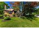 Quaint brick home featuring a well-manicured lawn and beautiful, mature shade trees at 1029 Katherwood Sw Dr, Atlanta, GA 30310