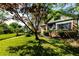 A charming brick home with mature trees and a well-manicured front lawn at 1029 Katherwood Sw Dr, Atlanta, GA 30310