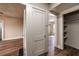 Hallway with a wooden door and shelves at 1029 Katherwood Sw Dr, Atlanta, GA 30310