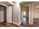 Hallway featuring beadboard walls, trim, and wood-look flooring that lead to the bedrooms at 1029 Katherwood Sw Dr, Atlanta, GA 30310