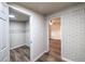 Hallway showing access to closet with shelving and view into bedroom at 1029 Katherwood Sw Dr, Atlanta, GA 30310