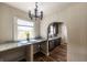 Eat-in kitchen with granite counters, stylish cabinets, stainless appliances and hardwood floors at 1029 Katherwood Sw Dr, Atlanta, GA 30310