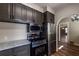 Open concept kitchen with stainless appliances, sleek gray cabinets and hardwood floors at 1029 Katherwood Sw Dr, Atlanta, GA 30310