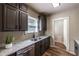 Modern kitchen with granite counters, stainless sink and appliances, and gray cabinets at 1029 Katherwood Sw Dr, Atlanta, GA 30310