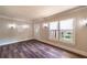 Cozy living room featuring hardwood floors, ample natural light and fresh neutral paint at 1029 Katherwood Sw Dr, Atlanta, GA 30310