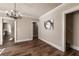 Open living room featuring decorative lighting and wood-look flooring at 1029 Katherwood Sw Dr, Atlanta, GA 30310