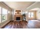 Spacious living room features hardwood floors, built-in shelves and a fireplace with brick surround at 1029 Katherwood Sw Dr, Atlanta, GA 30310