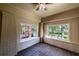 Bright and airy sun room featuring brick walls, tiled floors, and large windows at 1029 Katherwood Sw Dr, Atlanta, GA 30310