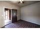 Inviting sun room with brick accent wall, tiled floors, and doorway to the porch at 1029 Katherwood Sw Dr, Atlanta, GA 30310