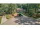 Beautiful home surrounded by mature trees and lush landscaping on a cul-de-sac at 2080 Old Dominion Rd, Atlanta, GA 30350