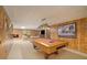 Wide angle shot of the basement featuring a pool table, fireplace, and ample space at 2080 Old Dominion Rd, Atlanta, GA 30350