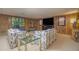 Finished basement with wood paneling, comfortable seating, and a retro aesthetic at 2080 Old Dominion Rd, Atlanta, GA 30350