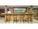 Basement wet bar with four stools and large mirror at 2080 Old Dominion Rd, Atlanta, GA 30350