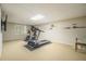 Finished basement gym with treadmill, stationary bike, and wall-mounted television at 2080 Old Dominion Rd, Atlanta, GA 30350