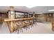 Basement bar area with ample seating, ping pong table and wood paneling at 2080 Old Dominion Rd, Atlanta, GA 30350