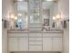 Double vanity bathroom with marble countertop, decorative lighting, and ample storage for a luxurious experience at 2080 Old Dominion Rd, Atlanta, GA 30350