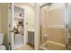 Ensuite bathroom featuring a shower with glass doors and a view into the bedroom at 2080 Old Dominion Rd, Atlanta, GA 30350