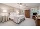 Cozy bedroom with neutral colors, a ceiling fan, and natural light at 2080 Old Dominion Rd, Atlanta, GA 30350