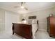 This bedroom showcases a wood sleigh bed, complemented by a ceiling fan and natural light at 2080 Old Dominion Rd, Atlanta, GA 30350