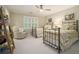 Charming bedroom features two twin beds, a comfortable chair, and a whimsical bookshelf at 2080 Old Dominion Rd, Atlanta, GA 30350