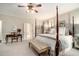 Primary bedroom with canopy bed, hardwood floors and neutral decor at 2080 Old Dominion Rd, Atlanta, GA 30350