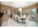 Inviting dining area with French doors to the outside, charming wallpaper, and seating for six at 2080 Old Dominion Rd, Atlanta, GA 30350