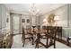Elegant dining room with traditional chandelier and decorative wall molding at 2080 Old Dominion Rd, Atlanta, GA 30350