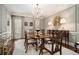 Elegant dining room features a chandelier, large dining table, and classic wall paneling at 2080 Old Dominion Rd, Atlanta, GA 30350