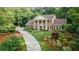 Beautiful home with mature trees, landscaped front yard and circular driveway at 2080 Old Dominion Rd, Atlanta, GA 30350