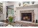 Cozy living room fireplace with brick surround and decorative mantle at 2080 Old Dominion Rd, Atlanta, GA 30350