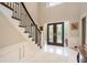 Grand foyer with high ceilings, marble floors, and a wrought iron staircase at 2080 Old Dominion Rd, Atlanta, GA 30350