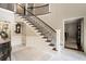 Spacious foyer with staircase, marble floors and view to the living spaces at 2080 Old Dominion Rd, Atlanta, GA 30350