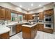 Spacious kitchen equipped with stainless steel appliances, double ovens, and center island with cooktop at 2080 Old Dominion Rd, Atlanta, GA 30350