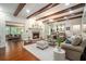 Cozy living room featuring hardwood floors, a fireplace and plenty of seating at 2080 Old Dominion Rd, Atlanta, GA 30350