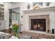 Inviting living room showcases a brick fireplace and classic decor, creating a warm and welcoming ambiance at 2080 Old Dominion Rd, Atlanta, GA 30350
