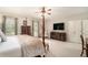 Large main bedroom featuring a four-poster bed, sitting area, and plenty of natural light for a tranquil setting at 2080 Old Dominion Rd, Atlanta, GA 30350