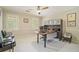 Bright home office with a ceiling fan, and a large desk and storage at 2080 Old Dominion Rd, Atlanta, GA 30350