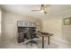 A home office features custom shelving, an executive desk, and ample storage at 2080 Old Dominion Rd, Atlanta, GA 30350