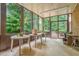 Relaxing sunroom features large windows and exterior views at 2080 Old Dominion Rd, Atlanta, GA 30350