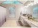 Bright bathroom with white cabinets, granite countertops, and a long vanity with lots of counter space at 253 Pine Valley Dr, Powder Springs, GA 30127